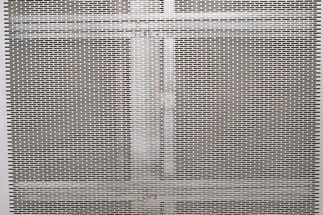 Mastering the First Impression: Your intriguing post title goes here Full frame textured background of gray metal surface with geometric holes in rows